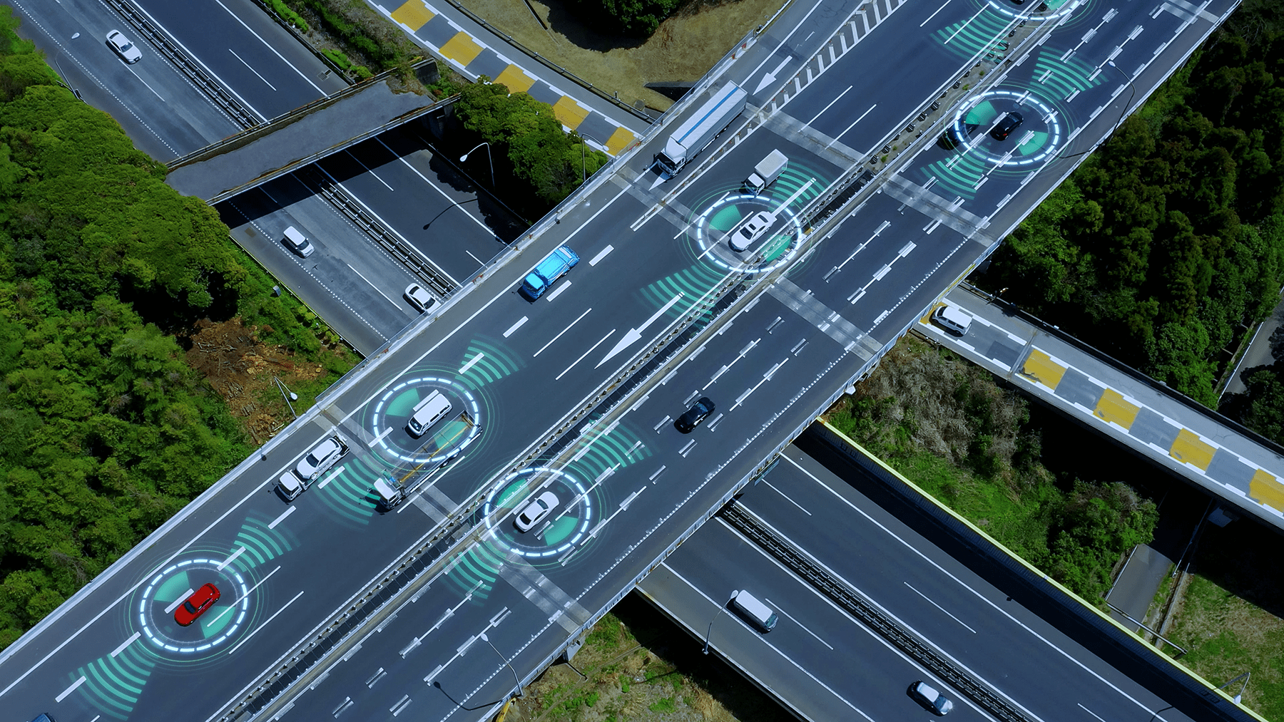 vehicles on a highway with connected illustrations around some of them