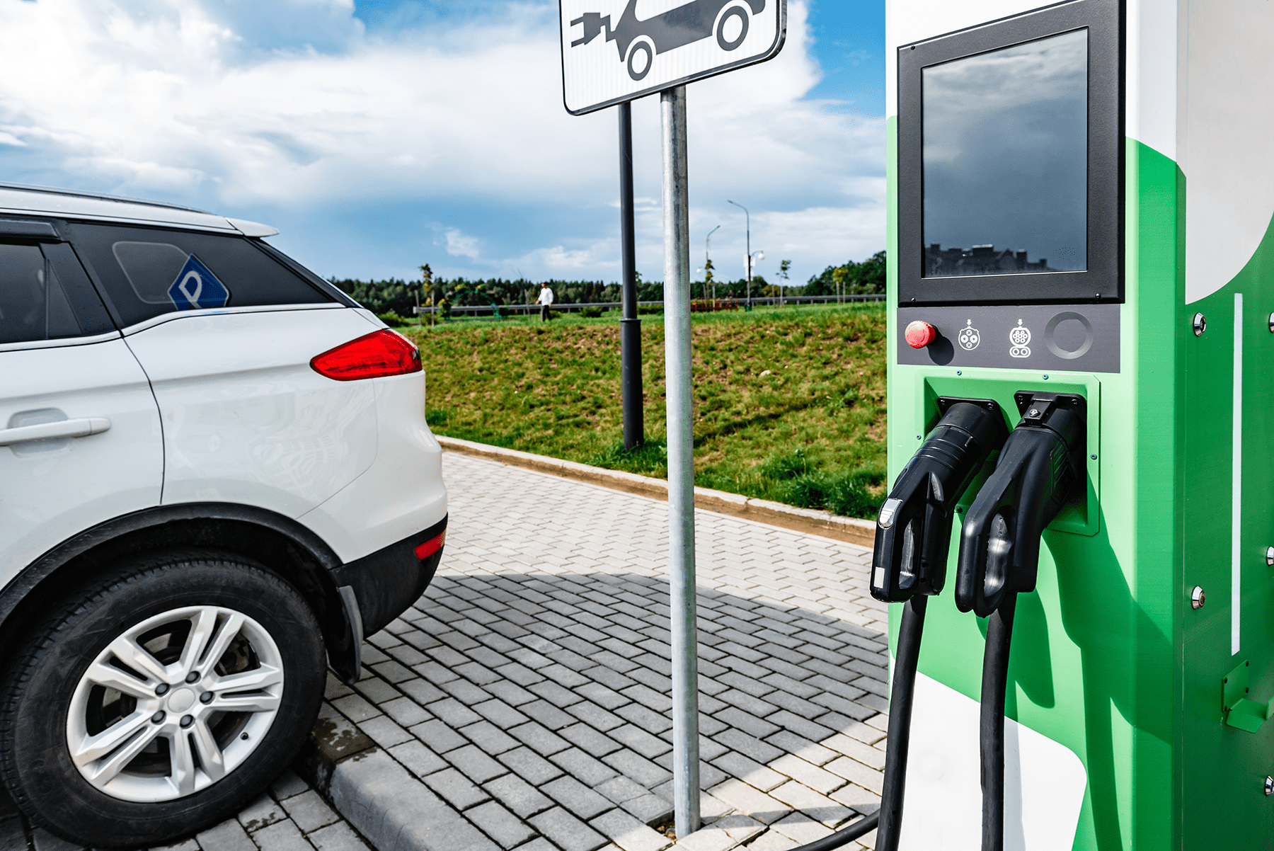 an electric vehicle charging at the charging station