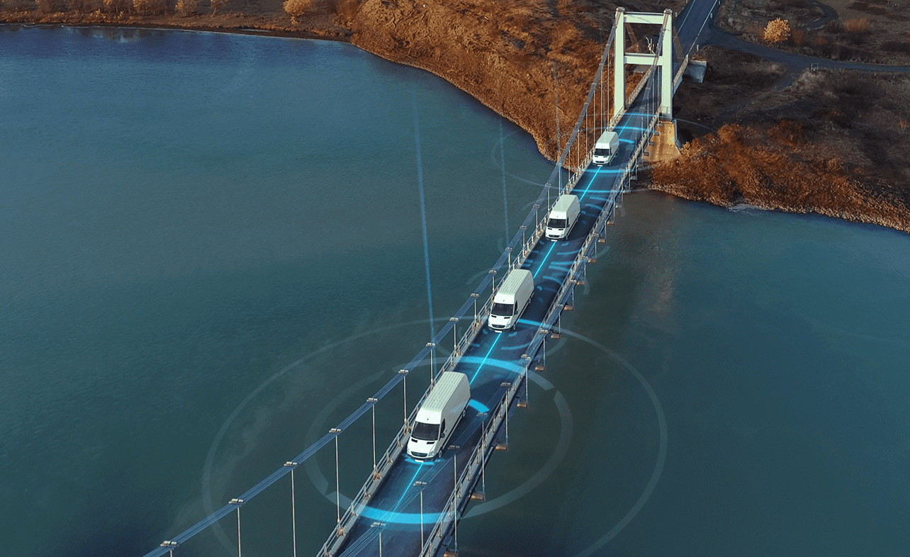 connected vans driving on the bridge